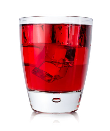 Red drink with ice cubes in a glass isolated on a white backgroundの写真素材