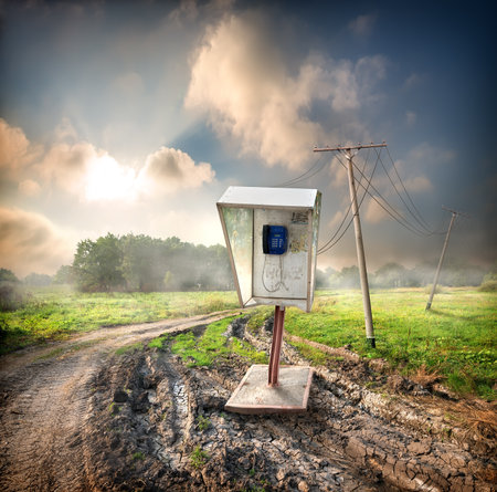 Old payphone on a road in the fieldの写真素材