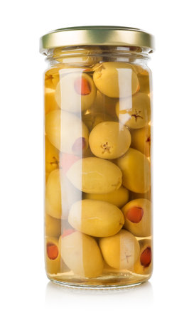 Olives in a glass jar isolated on a white backgroundの写真素材