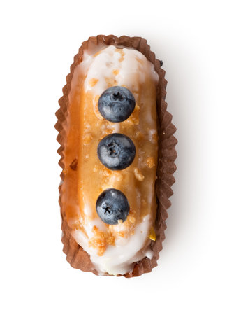 Eclair in white glaze isolated on a white background