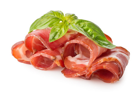 Bacon with herbs isolated on a white backgroundの写真素材