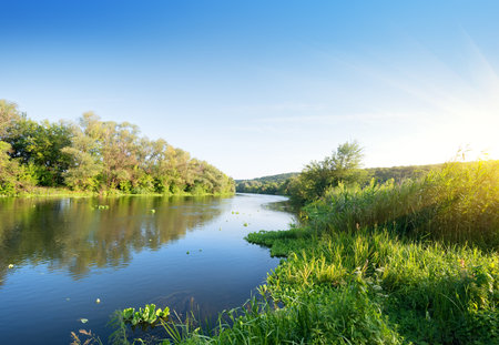 Beautiful silent summer river under the evening sunの写真素材