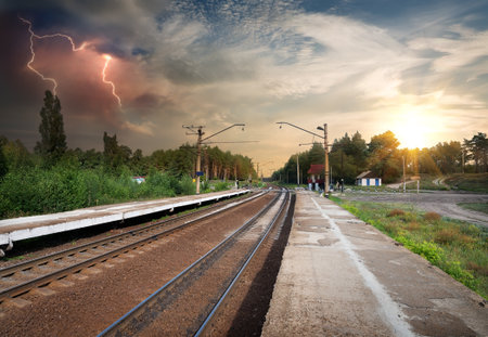 Bad weather and storm clouds over railroadの写真素材