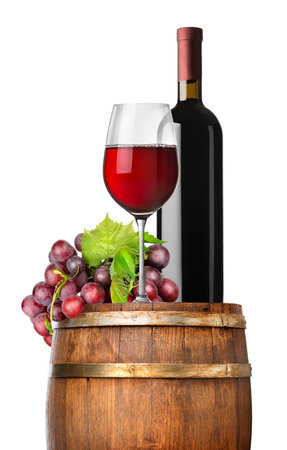Grape and wine on a barrel isolated on whiteの写真素材