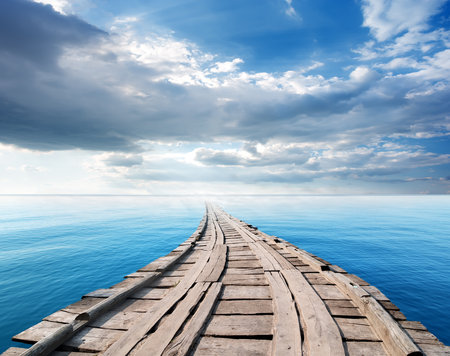 Bridge in the ocean against the skyの写真素材
