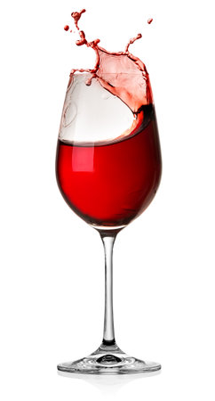 Moving red wine glass over a white backgroundの写真素材
