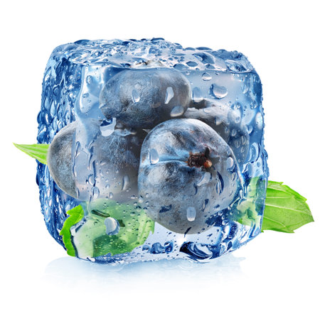 Ice cube with blueberries isolated on whiteの写真素材
