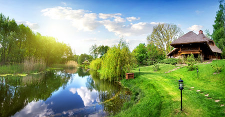 House of log near river in the morningの写真素材