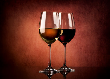 Two glasses of wine on a textured backgroundの写真素材