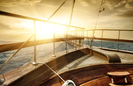 Ship in the sea in sun beamsの写真素材
