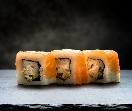 Delicious rolls on a slate table and black backgroundの写真素材
