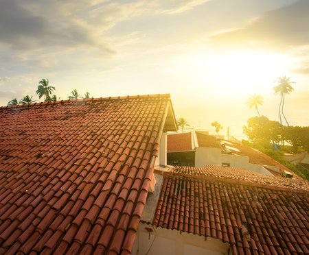 View on the ocean from a roof at sunsetの写真素材