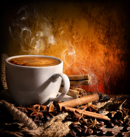 Still life with coffee and spices on orange backgroundの写真素材