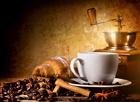 Coffee with fresh croissant and coffee millの写真素材