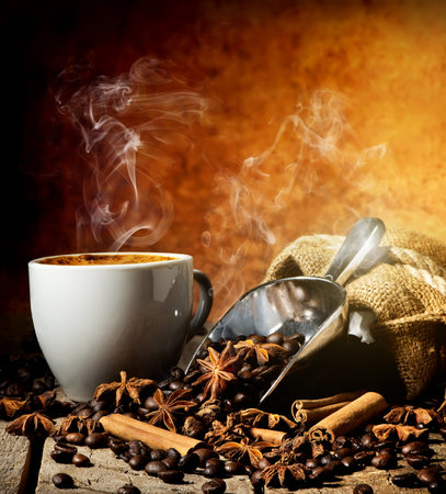 Spices with cup of coffee on a wooden tableの写真素材