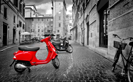 Rome, Italy - June 18, 2016. Small red motorbike on roman street, Italyのeditorial素材