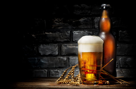Beer in glass and bottleの写真素材