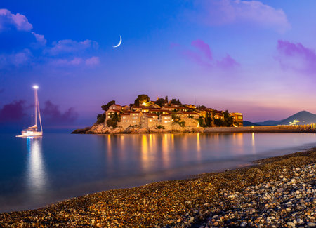 Sveti Stefan island in Montenegro, sunset on the seacoast. Popular travel destination.のeditorial素材