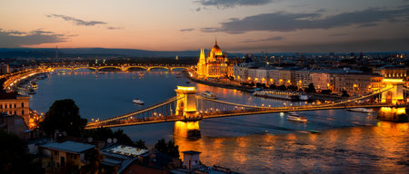 Parliament and bridges of Budapest illuminated in evening, Hungaryの写真素材