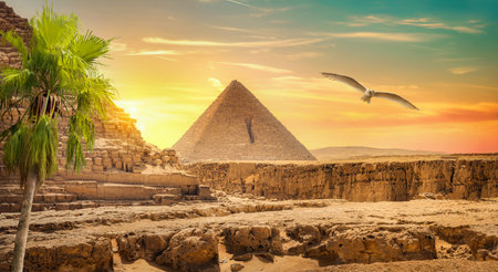 Egyptian pyramid in sand desert and clear skyの写真素材