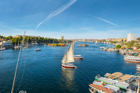 River Nile and boats at sunset in Aswanの写真素材