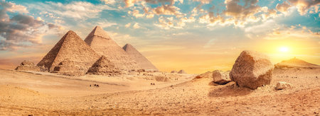 Row of pyramids in desert of Giza at sunset, Egyptの写真素材