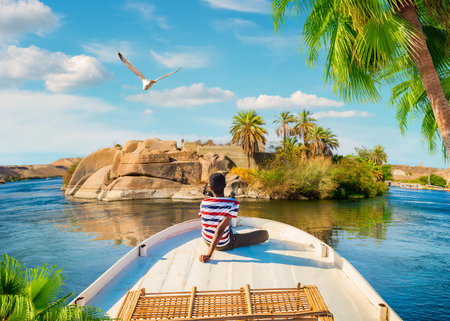 River Nile and boats at sunset in Aswanのeditorial素材