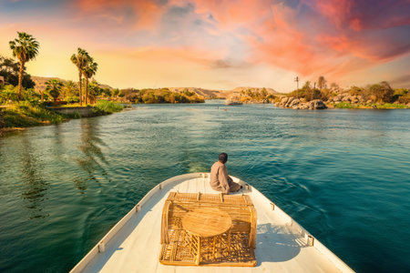 River Nile and boats at sunset in Aswanのeditorial素材