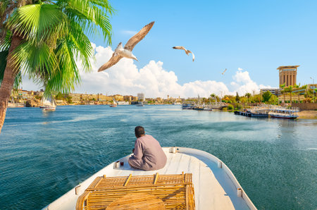 River Nile and boats at sunset in Aswanのeditorial素材