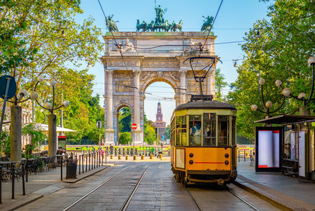 View of the Peace Arch with yellow tram in Milan, Italyの写真素材