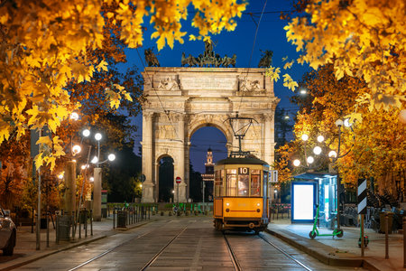 View of the Peace Arch with yellow tram in Milan, Italyの写真素材