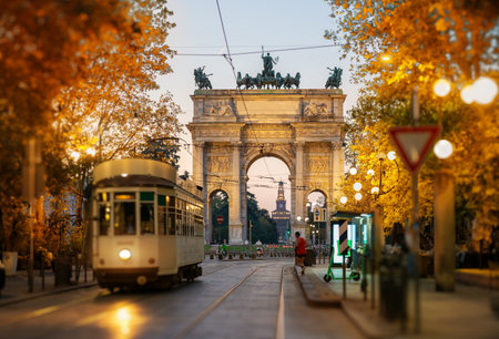 View of the Peace Arch with yellow tram in Milan, Italyの写真素材