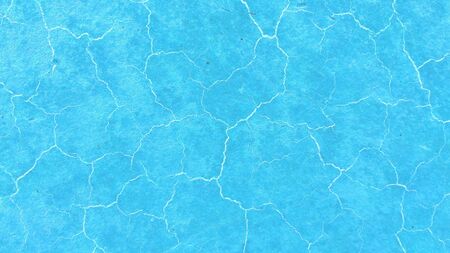 Beautiful light blue background. Light cracks on the surface. Texture of old paint. Blue soil...