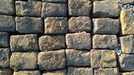 Stone pavement texture. Granite cobblestoned pavement background. Abstract background of old cobblestone pavement close-up. Prague. View from above. Close upの写真素材