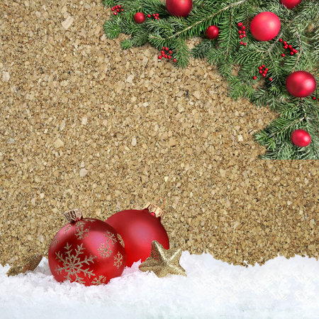 Golden shiny texture with red balls on white snowの写真素材
