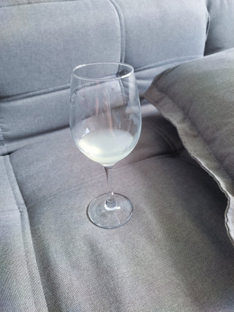 A glass on a gray sofaの写真素材
