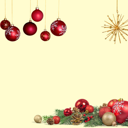 Christmas photo with yellow background and Christmas decoration with red balls, golden star looking like a fireworks, green pine leaves and golden ballsの写真素材