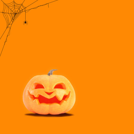 Halloween pumpkin on orange background with spider web and copy space. Jack o lantern 3d render.の写真素材