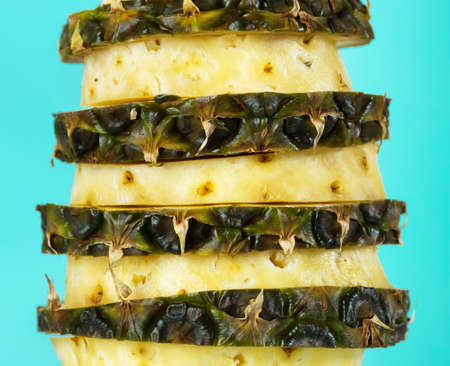 Cut pineapple on a bright blue background