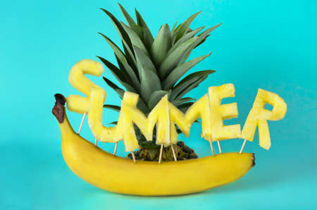 The inscription summer from the fruit. Pineapple and bananaの写真素材