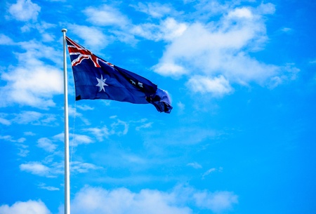Australia flag with blue skyの写真素材