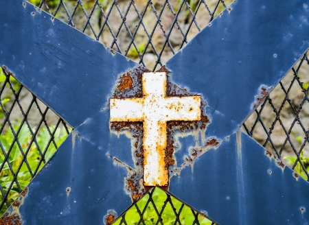 Rusty cross on steelの写真素材