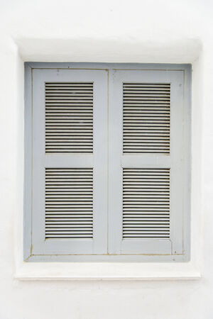 Gray wooden window on white wall2の写真素材