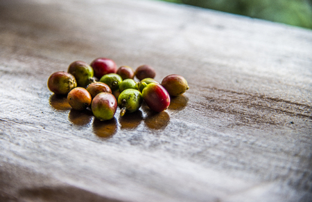 Fresh coffee beans on wooden tableの写真素材