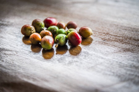 Fresh coffee beans on wooden tableの写真素材