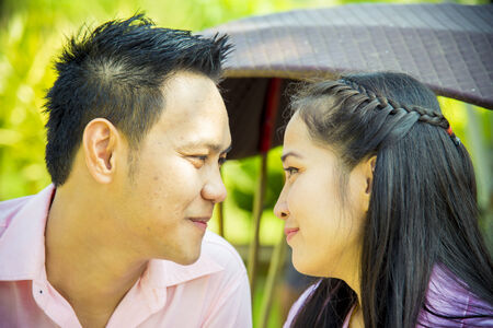 Lovely couple look together in romance sceneの写真素材