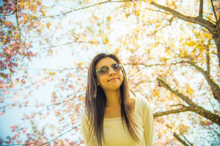 Woman wear eyeglass with pink cherry flower tree6の写真素材