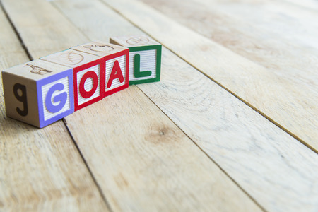 Wooden blocks are Goal word on wooden floorの写真素材