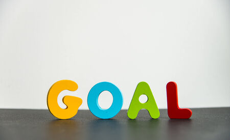 Colorful Wooden word goal with white backgroundの写真素材