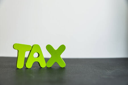 Colorful Wooden word tax with white backgroundの写真素材